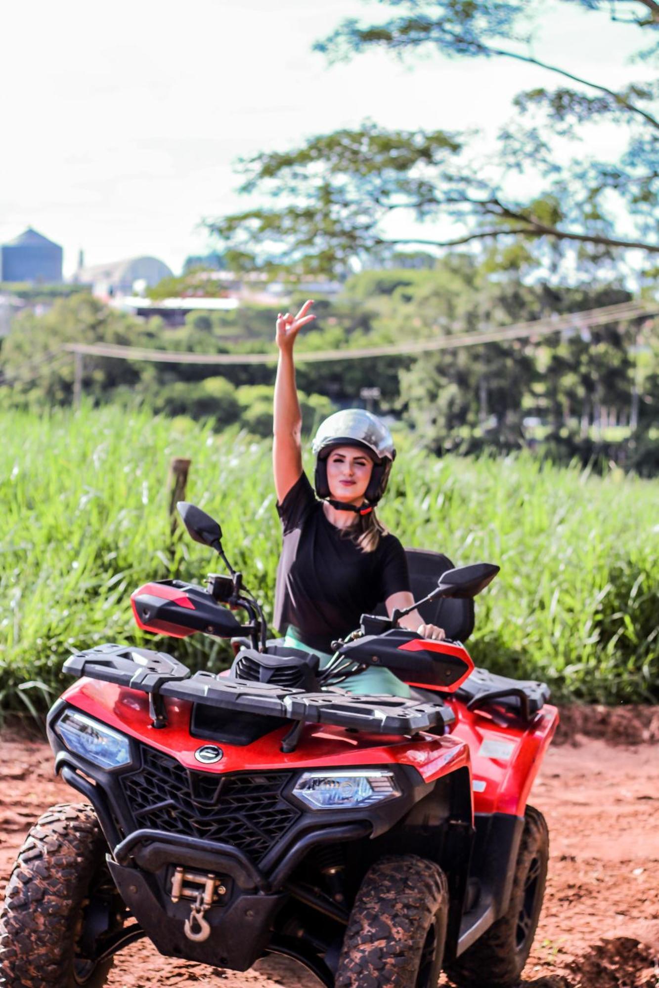 Blue Tree Thermas De Lins Resort Exteriér fotografie A woman on a quad bike